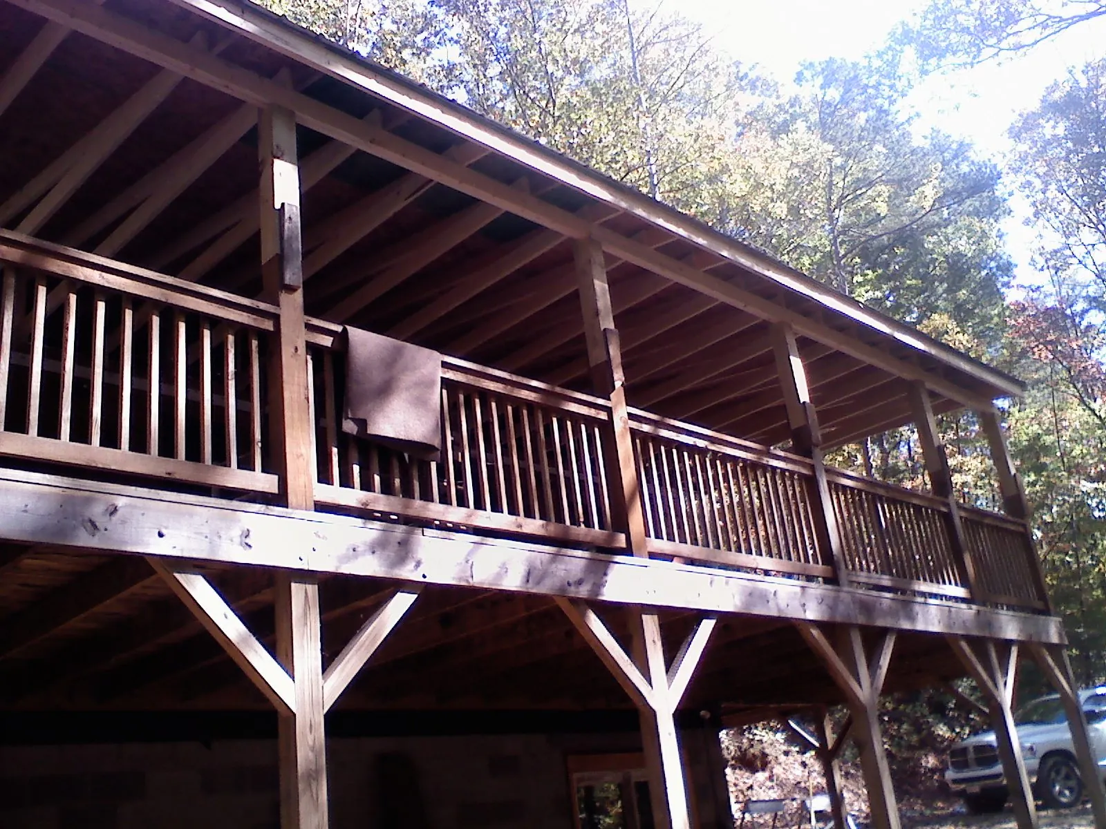 Timber framing under a new elevated porch and deck — Roof Leak Repair in Millwood by Roofing Brothers